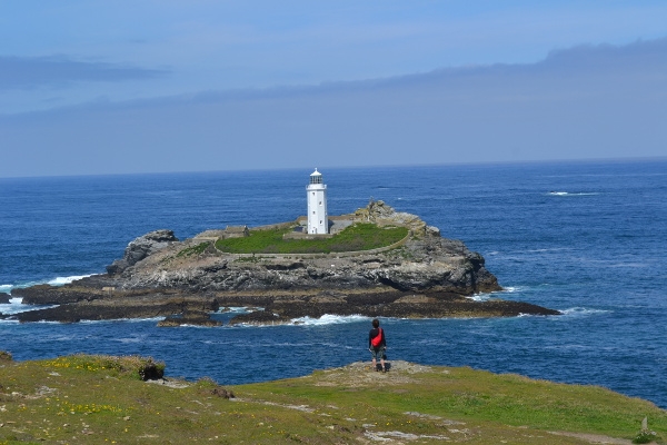 On the coast of Cornwall, England in 2013, a person concerned about man-made global warming and rising oceans looks out on the beautiful world we have today.